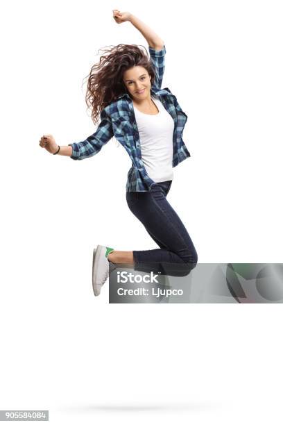 Overjoyed Teen Girl Jumping And Gesturing Happiness Stock Photo - Download Image Now