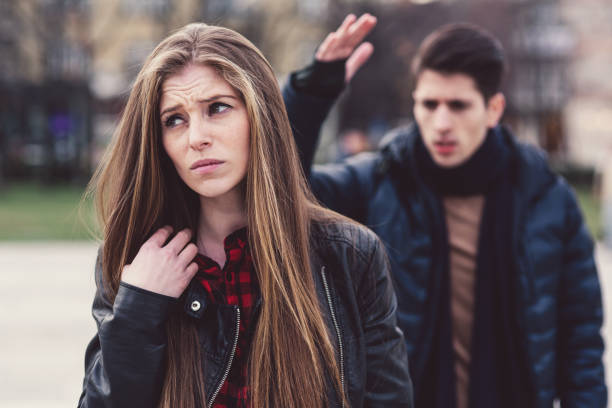 istock Young couple arguing on the street. 905586830