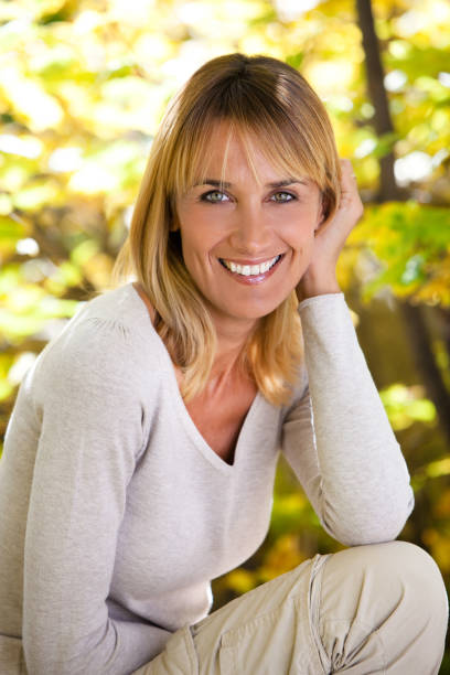 istock happy woman in automn 905588012