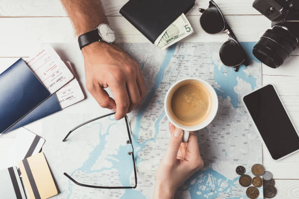 istock Couple planning travel with map 905594844
