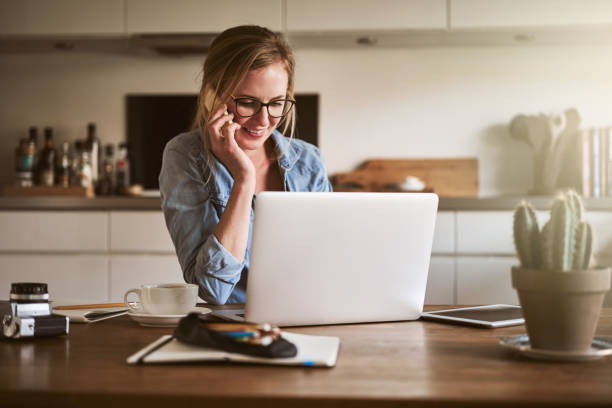 istock Entrepreneur talking on the phone while working online at home 905595772