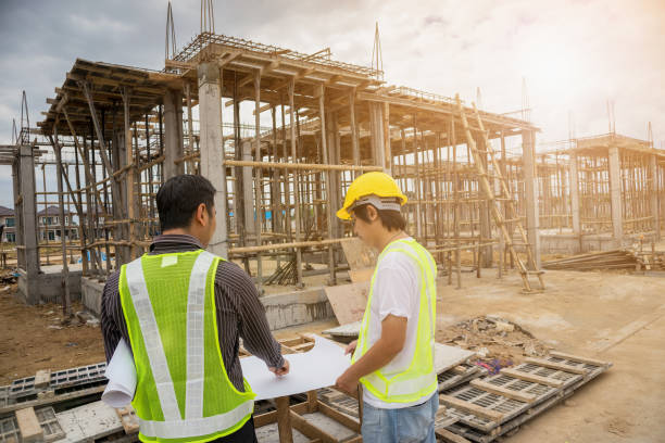 istock Asian business man construction engineer workers at house building site 905596010