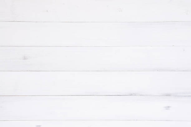 istock White wood texture background surface with old natural pattern or old wood texture table top view. Grunge surface with wood texture background. Vintage timber texture background. Rustic table top view. 905598766