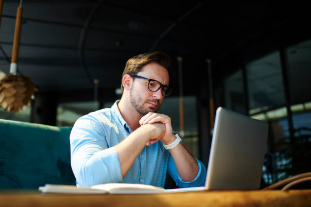 istock Pensive executive manager analyzing marketing strategy for online startup reading information received on mail.Concentrated experienced financial manager checking budget accountings working on report 905599722