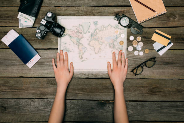 istock woman hands on map 905599750