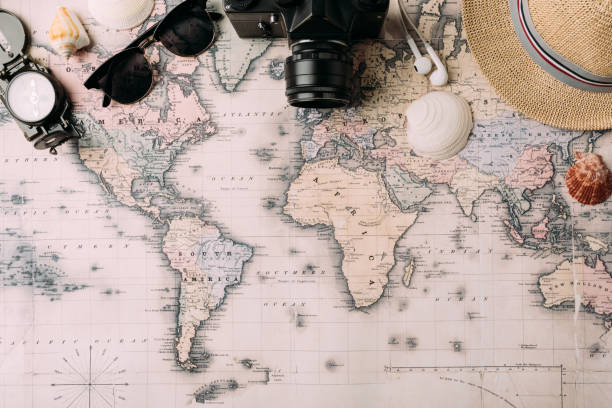 istock film camera with sunglasses and compass on map 905600162