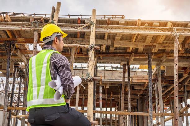 istock professional engineer worker at the house building construction site 905603984