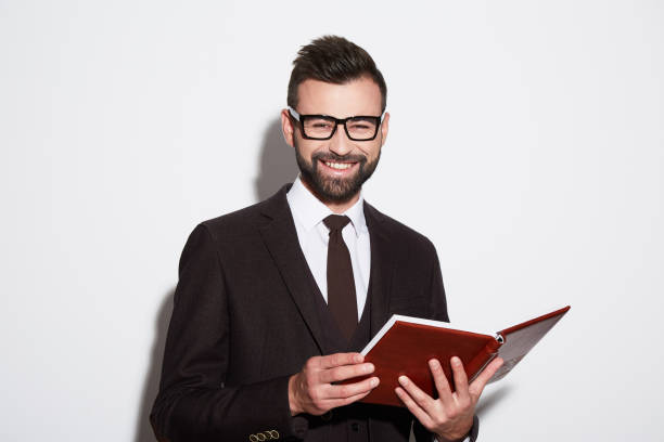 istock Portrait of handsome man at white background 905608412