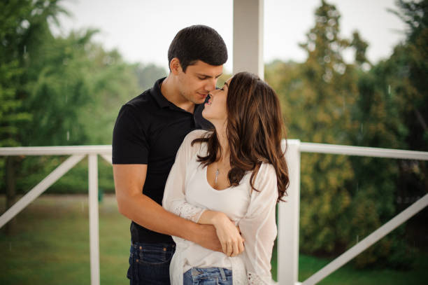 istock Young couple in love on the outdoors background 905608436