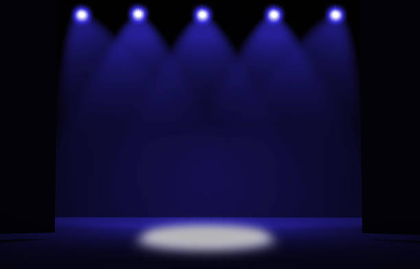 istock Stage lights ,free stage,concerrt stage .Several projectors on the ceiling. Spotlight strike through the darkness to the floor. 905609414