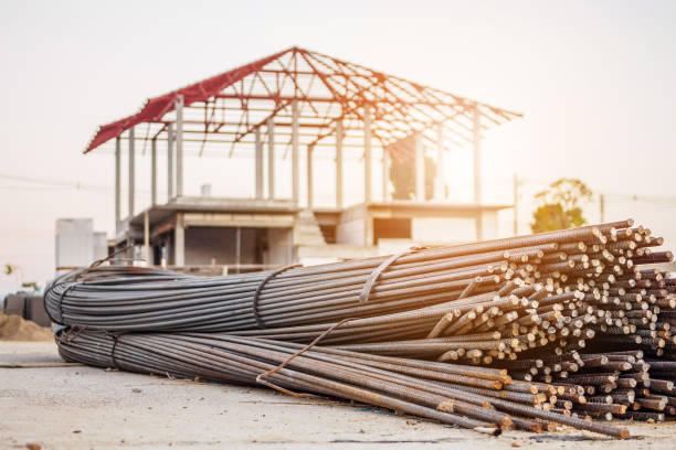 istock steel rebar for reinforcement concrete at construction site with house under construction background 905609510