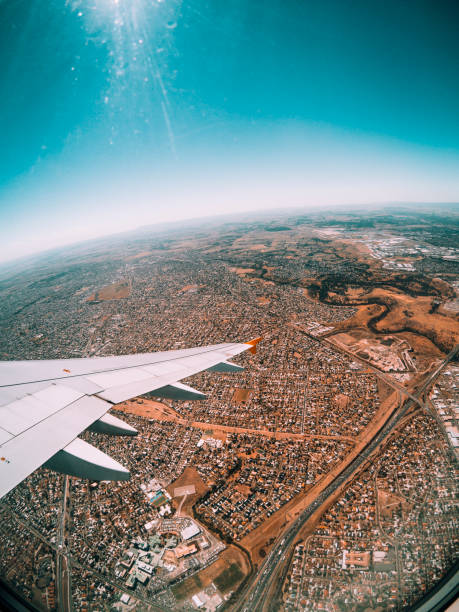 View from a plane window while flying over Melbourne, Victoria. The aircraft wing can also be seen.