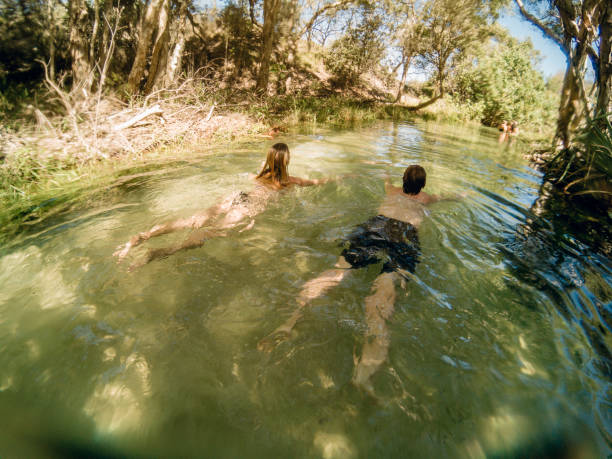 istock Swimming in the River 905623090