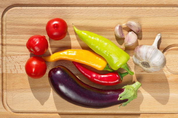 istock Fresh vegetables on wooden cutting Board 905626882