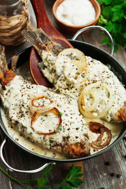 istock Fish in sour cream sauce 905632756