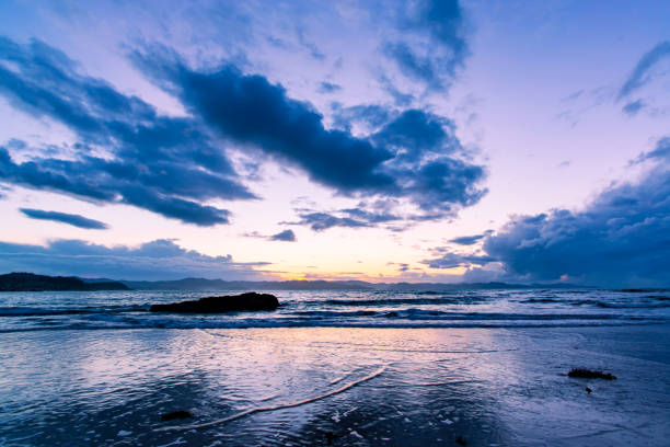 istock Sunset above the sea and a mountain range 905633460