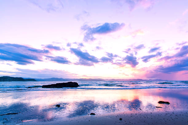 istock Sunset above the sea and a mountain range 905633552