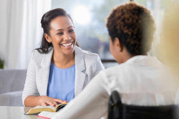istock Cheerful women participate in Bible study 905636464