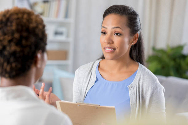 istock Mental health professional evaluates female patient 905636466