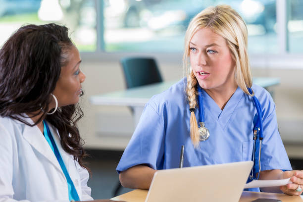 istock Medical colleagues discuss policy and procedures 905636994