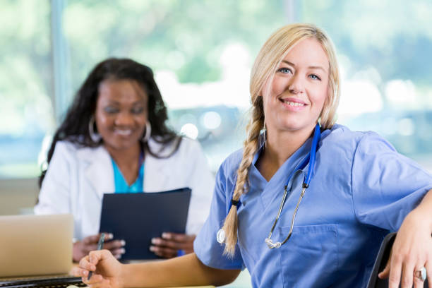 istock Beautiful Caucasian nurse during meeting 905637006