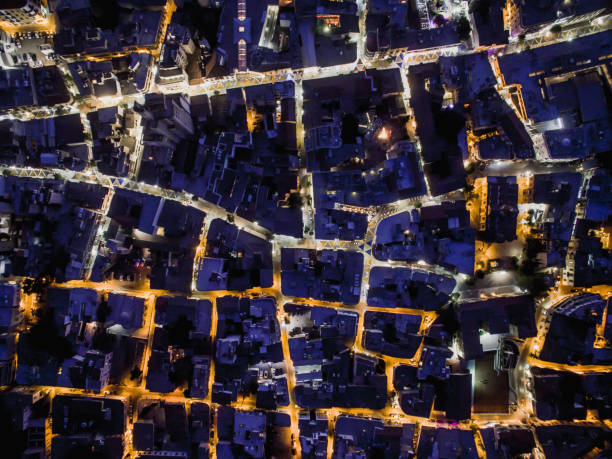 Aerial top down view of the old city of Nicosia during night time Visible are the two shopping districts of Ledra and Onasagorou. Half the streets are lit with white LED lights while the rest are lit by old tungsten lights. nicosia cyprus stock pictures, royalty-free photos & images