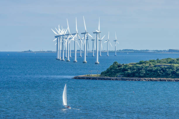 Offshore wind farm in the Baltic Sea near Copenhagen, Denmark Offshore wind farms are constructed in bodies of water, usually in the   ocean on the continental shelf, to harvest wind energy to generate electricity. offshore wind farm stock pictures, royalty-free photos & images