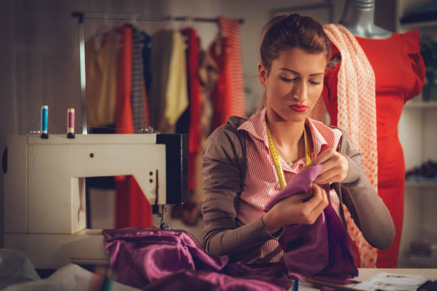 istock Young Woman Tailor Sewing 905648410