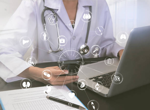 istock Female doctor working at office desk and mobile phone with computer. 905652722