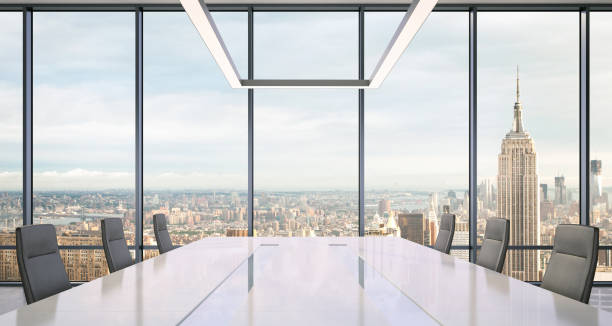 istock Large modern office desk with view at the skyscrapers 905659988