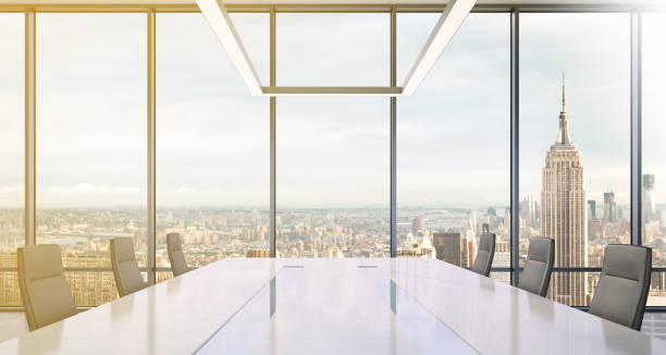 istock Large modern office desk with view at the skyscrapers 905660000