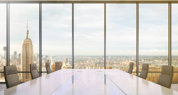 istock Large modern office desk with view at the skyscrapers 905660018