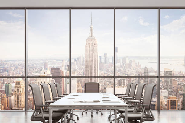 istock Large modern office desk with view at the skyscrapers 905660040