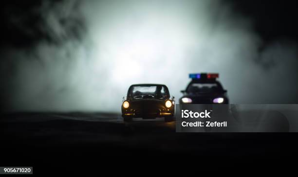 Toy Bmw Police Car Chasing A Ford Thunderbird Car At Night With Fog Background Toy Decoration Scene On Table Selective Focus U2013 11 Jan 2018 Baku Azerbaijan Stock Photo - Download Image Now