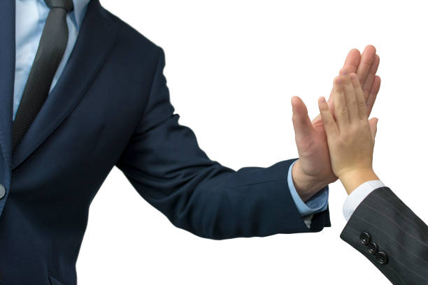 istock father and son in formal wear giving high five on white 905671870