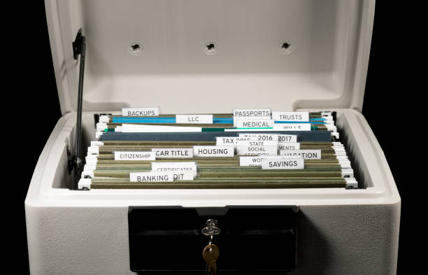 Home filing system for taxes organized in folders Close up of a well organized home filing system with tabs for each subject in fireproof safe filing cabinet photos stock pictures, royalty-free photos & images