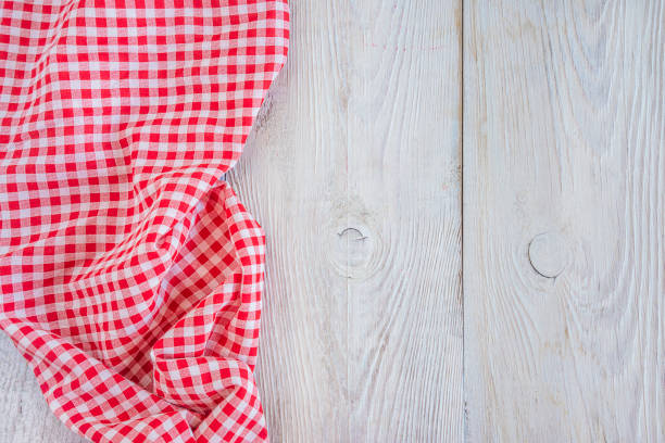istock red and white checkered napkin on white wooden planks 905675170
