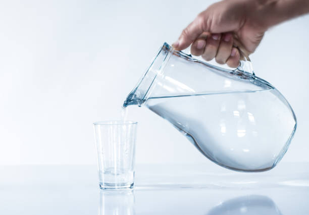 istock the man is filling water cup.DRİNK WATER. 905678416