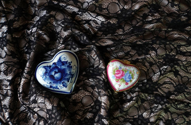 Boxes in the shape of a heart. A fragment of the dress. The pictures drawn. A symbol of love. Valentine's day. Design element.