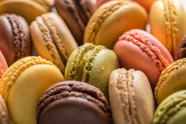 istock sweet macaroons cake like background, pastel colors 905679184