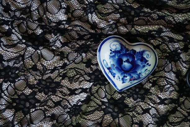 Two boxes in the shape of a heart. A fragment of the dress. The pictures drawn. A symbol of love. Valentine's day. Retro. Vintage. Design element.