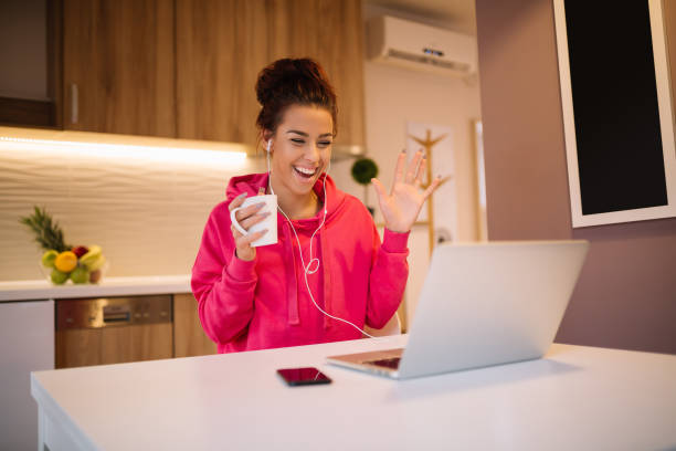 istock Young pretty girl with notebook having video chat. 905682106