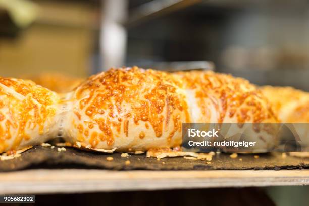 Baking Pastries And Bread In An Oven At A Bakery Stock Photo - Download Image Now - Bagel, Baked, Bakery