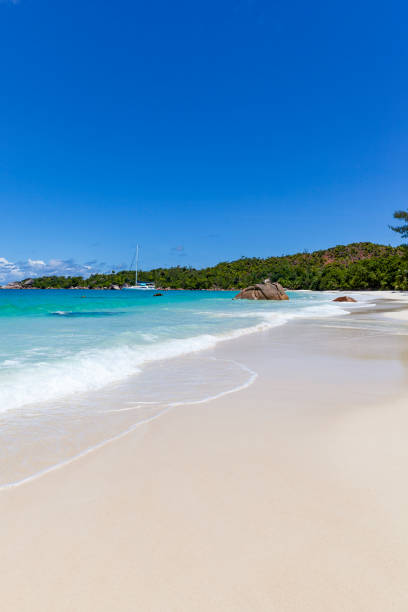 tropical white sand beach on praslin island, seychelles islands.