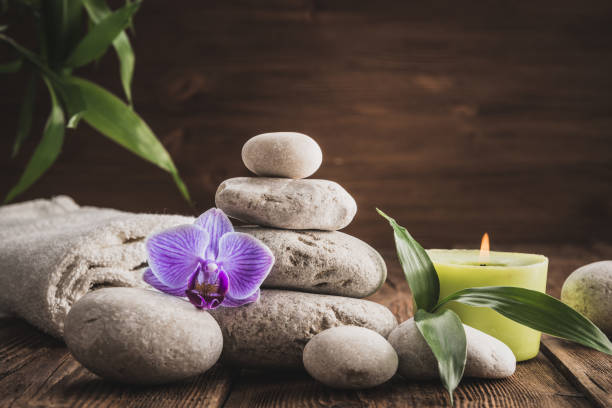 istock Stones hot stone, Orchid, bamboo and candle. Zen relaxation 905683354
