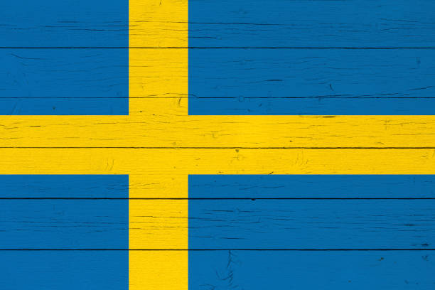 istock Flag on wooden background 905683422