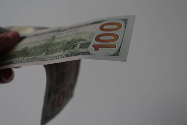 istock dollar bills one hundred dollars 905683806