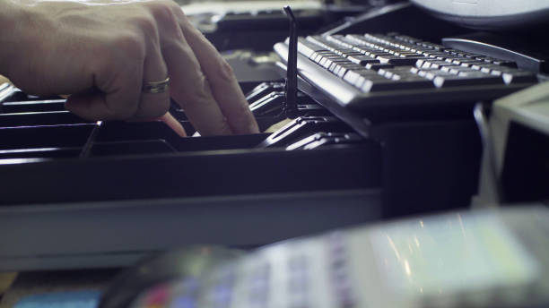 istock Man's hands putting money in cash box 905683904