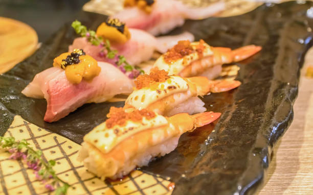 istock Sushi roll with salmon and shrimp tempura 905683990