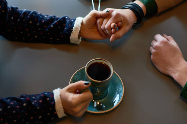 istock Young couple dating in cafe 905684102